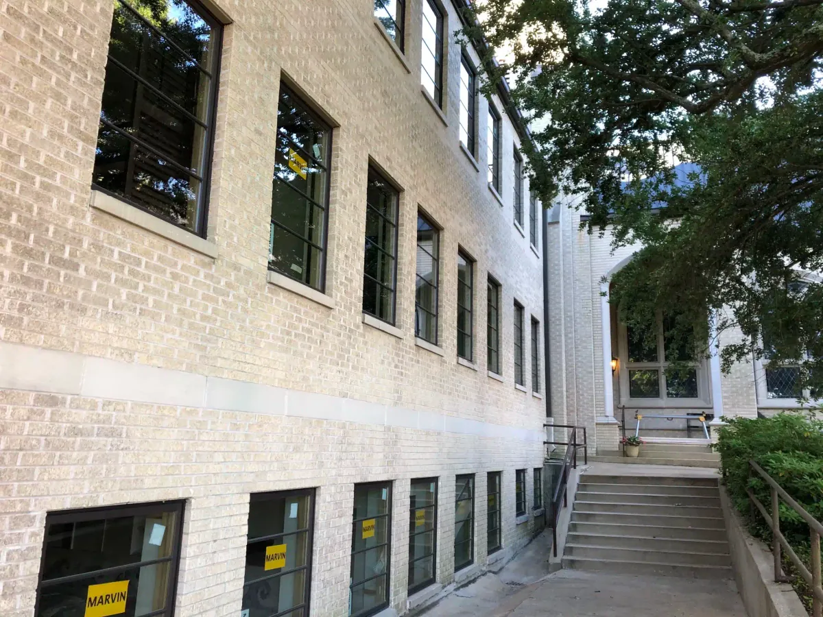 Brick church building with new windows installed on every floor